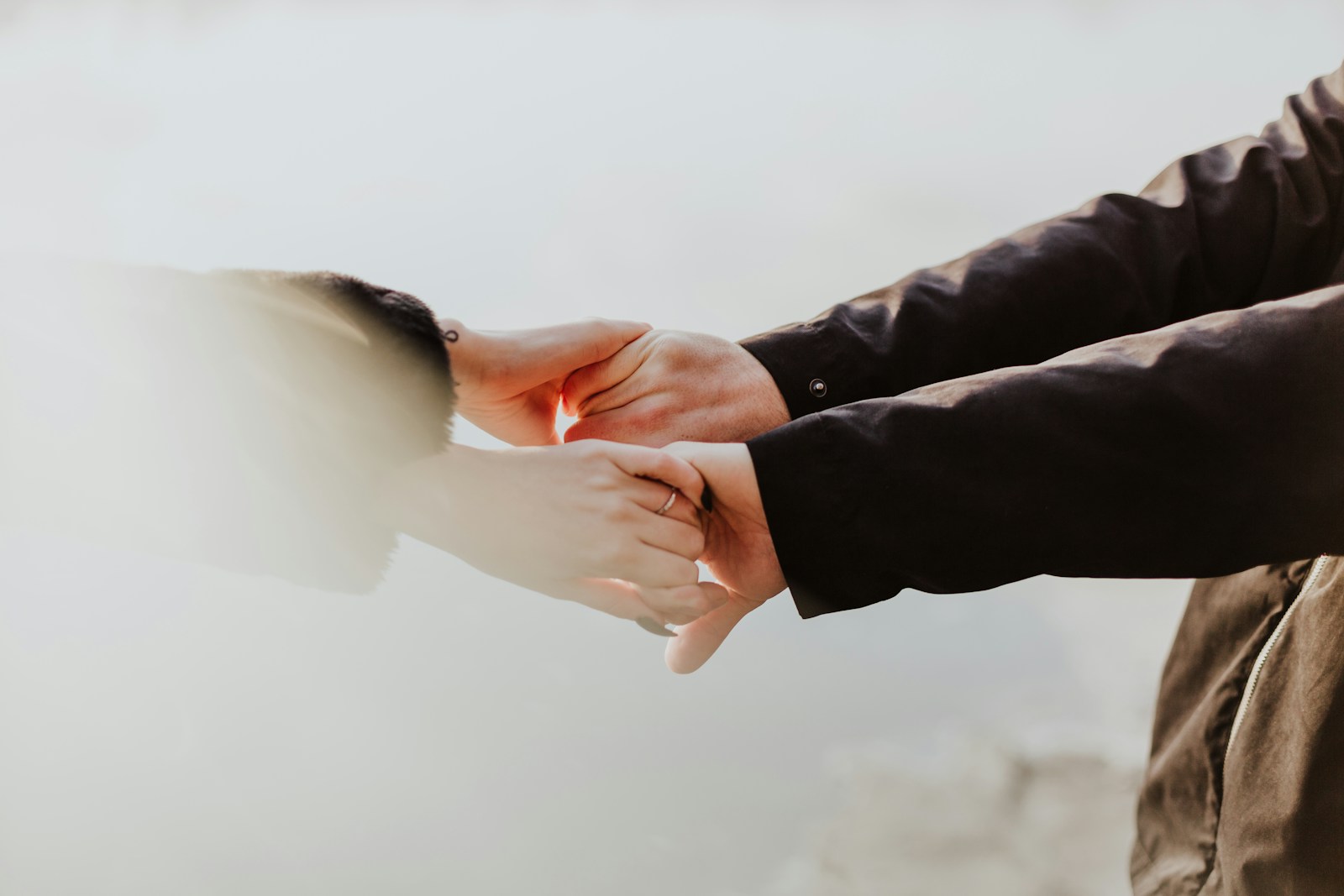 holding hands in sign of support for mental health issues